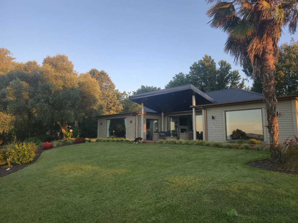 A completed Wagstaff new build at golden hour with weatherboard cladding and a wide covered verandah